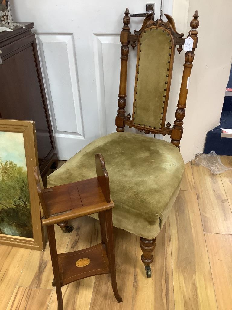 A Victorian nursing chair and an Edwardian book table